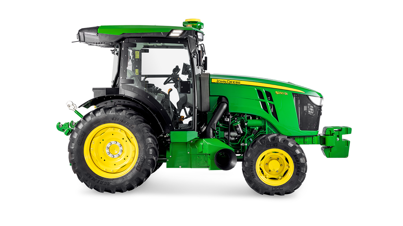 Boční profil traktoru John Deere 5090EN, zdůrazňující design kabiny a velké zadní pneumatiky.